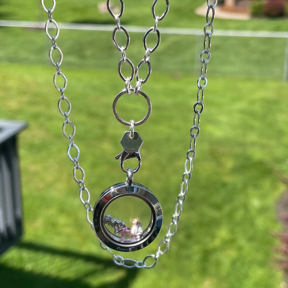 Sterling silver pendant necklace with charm holder.